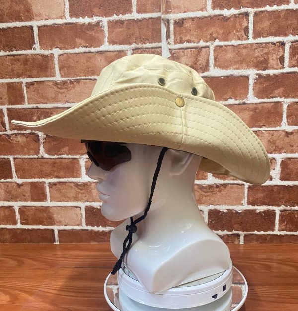 Beige wide-brim outdoor hat with chin strap and sunglasses.