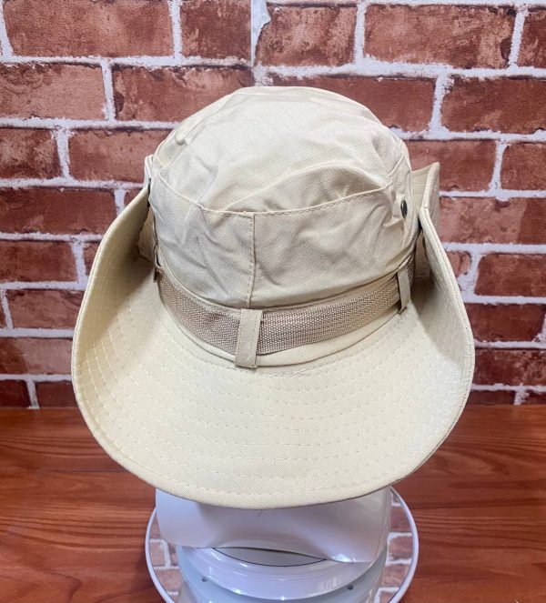Beige outdoor tactical hat with wide brim and adjustable strap.