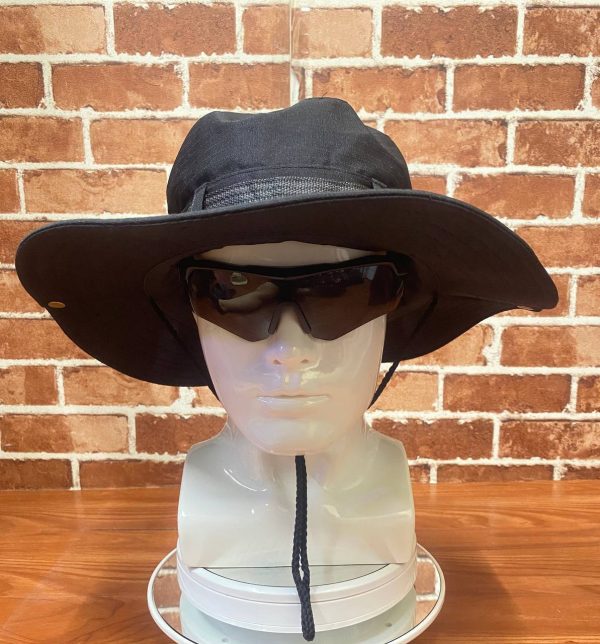 Black wide-brim hat with chin strap and sunglasses on mannequin head.