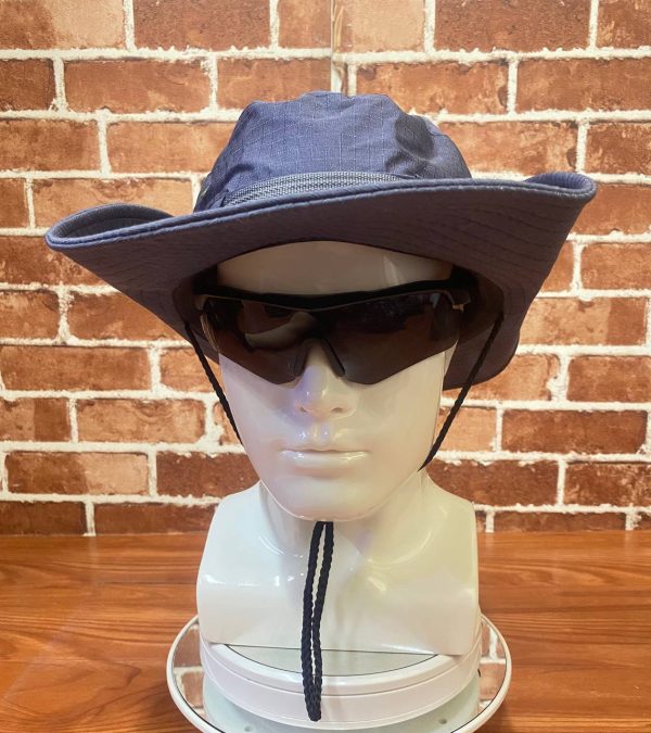 Blue wide-brim outdoor hat with chin strap and black sunglasses on mannequin head.